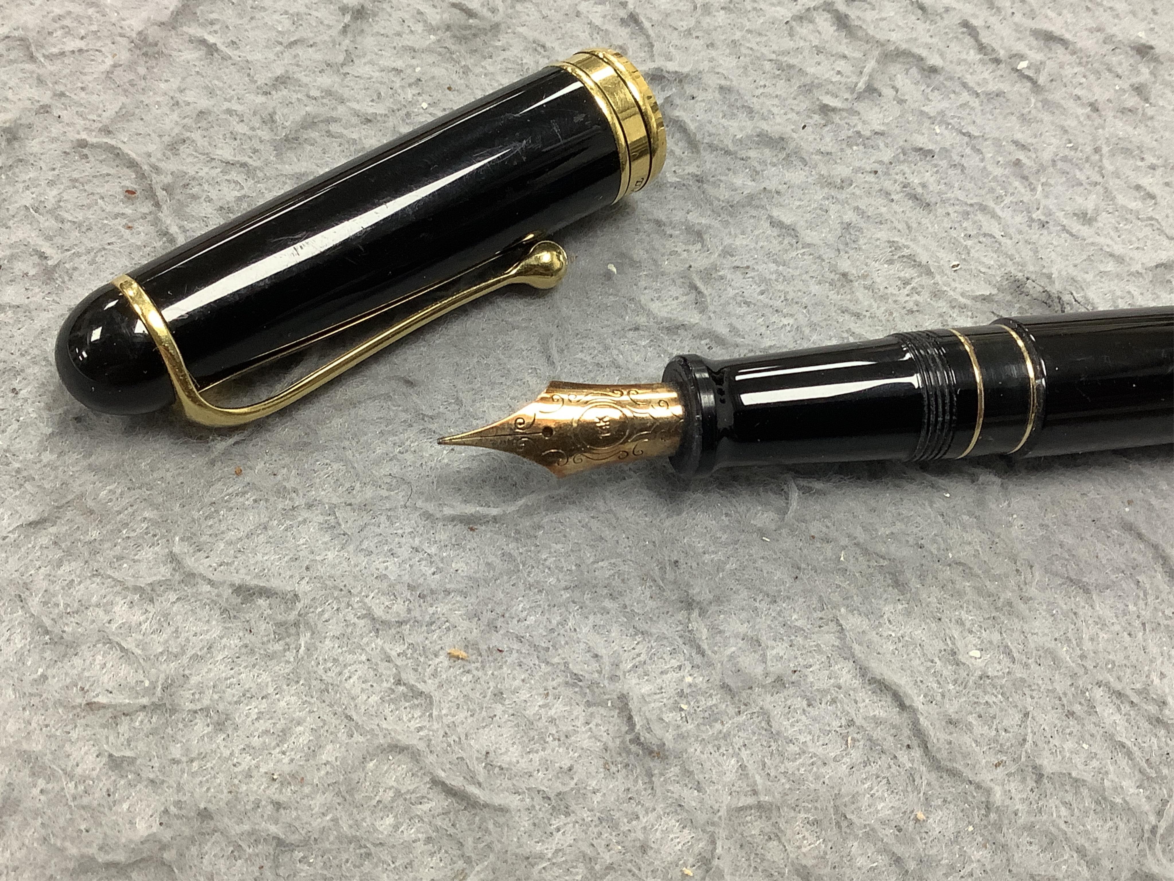 A Montblanc 146 vintage fountain pen, in original case, along with Aurora fountain pen and two others (4)